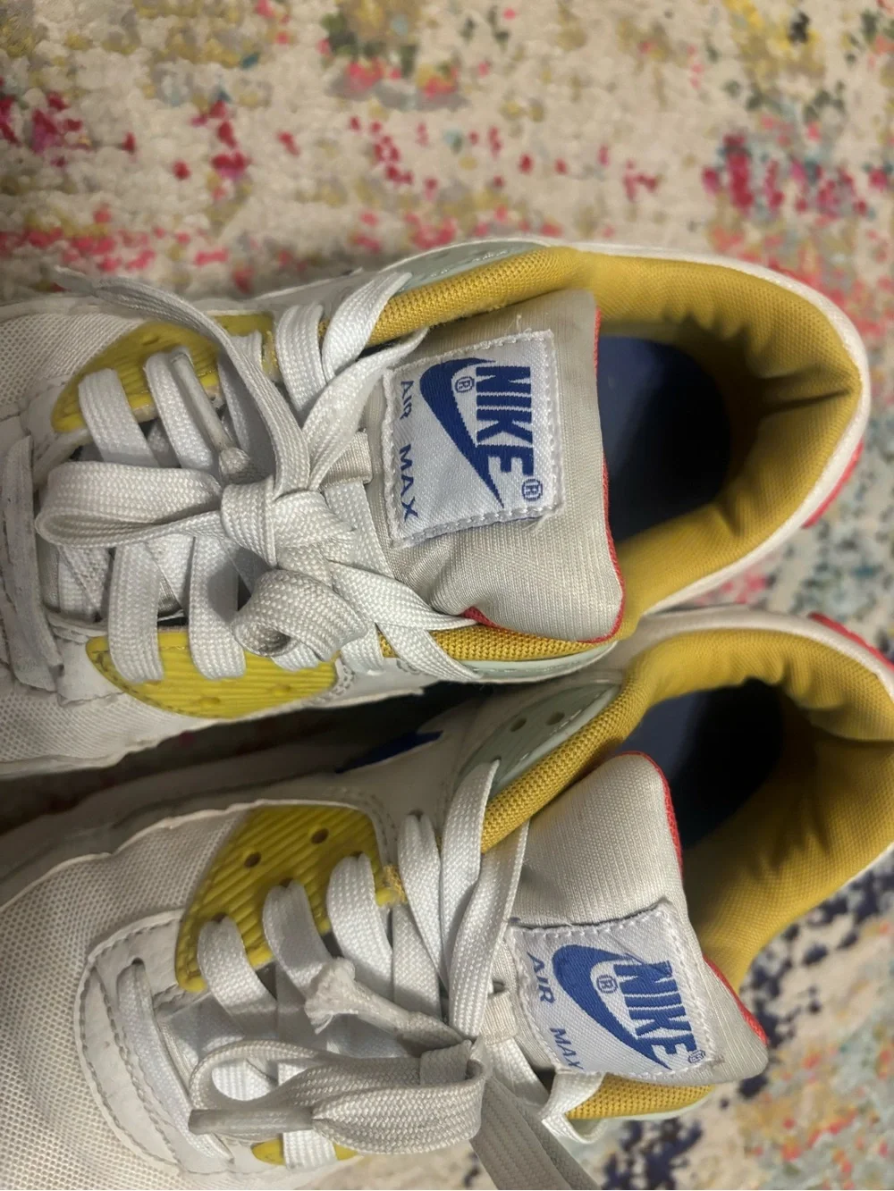 Nike Women's White Sneakers with Blue Swoosh and Yellow Lining